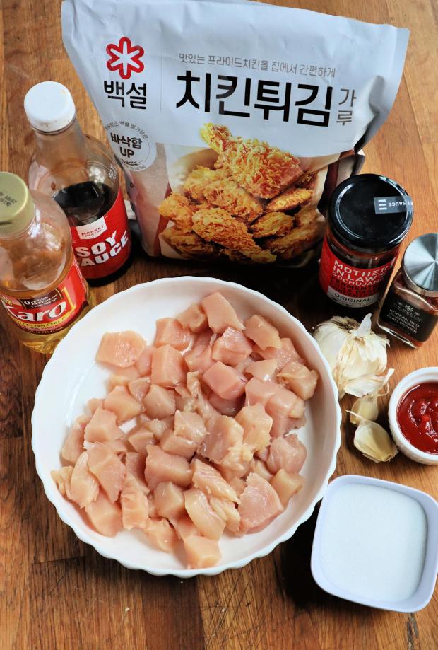 Ingredients for Korean fried chicken include corn syrup, soy sauce, garlic, red chili paste and flakes and Korean seasoned fried chicken mix. (Gretchen McKay/Pittsburgh Post-Gazette/TNS)