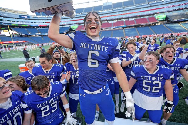 Scituate's Grayson Foley screams out in celebration after his team nipped Tewksbury, 42-41, for the state title. (Photo By Matt Stone/Boston Herald)