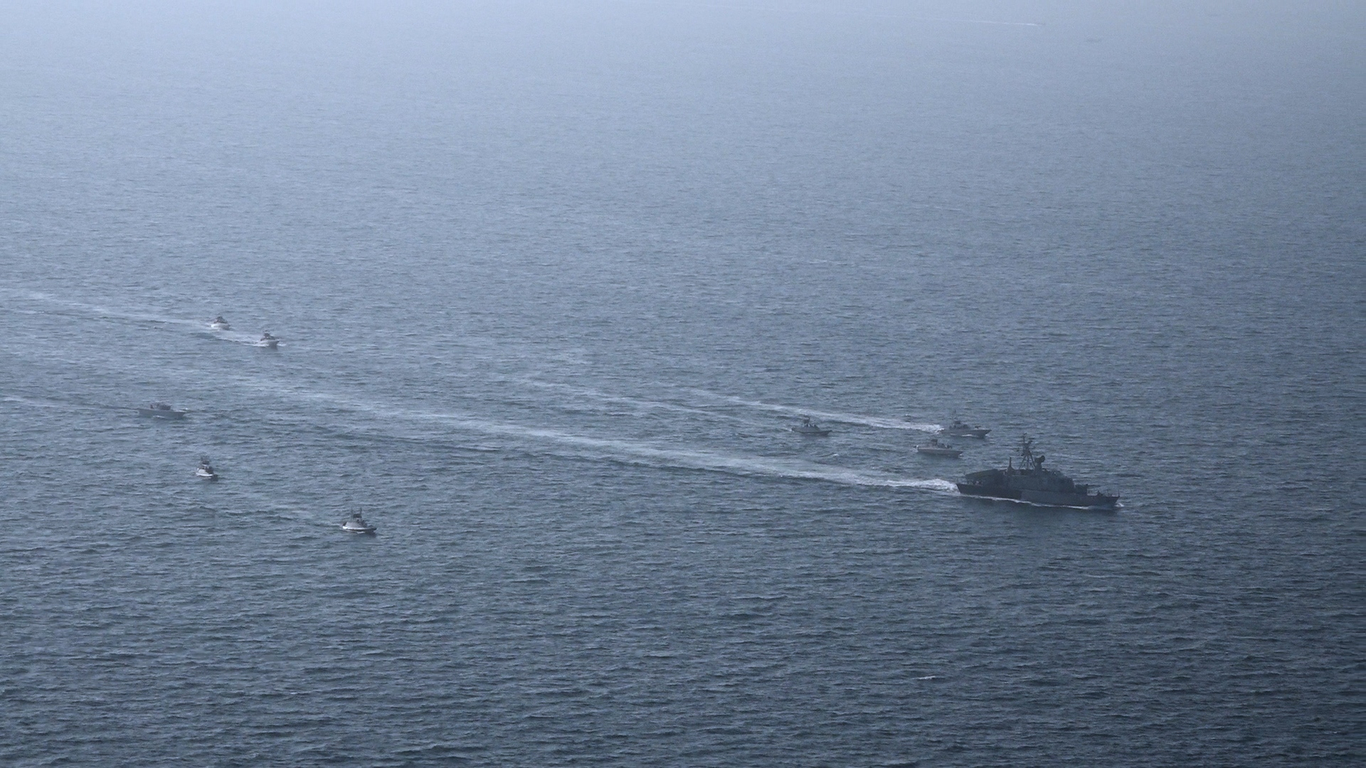 A photo shows the Iranian Revolutionary Guard's drill in the Persian Gulf.