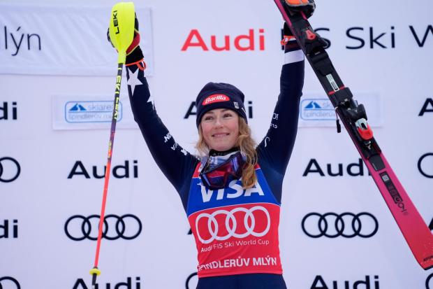 United States' Mikaela Shiffrin celebrates on podium after winning an alpine ski, women's World Cup slalom, in Spindleruv Mlyn, Czech Republic, Sunday, Jan. 25, 2026. (AP Photo/Giovanni Auletta)