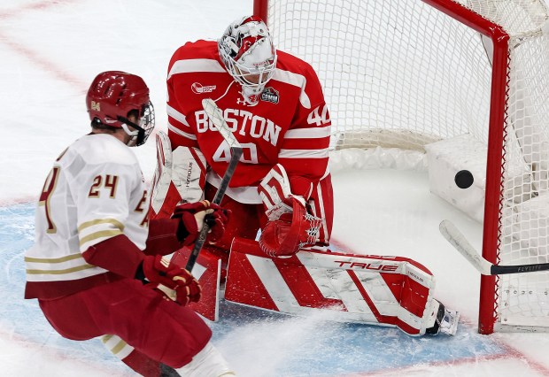 Andre Gasseau of the Boston College Eagles scores on Mikhail Yegorov of the Boston University Terriers during the first period of the Beanpot championship at TD Garden. (Photo By Matt Stone/Boston Herald)