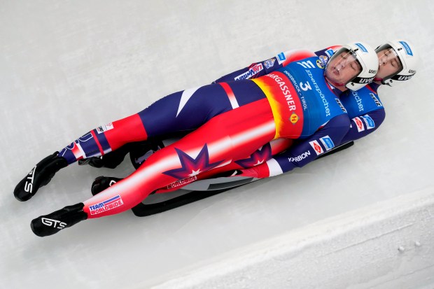 Marcus Mueller and Ansel Haugsjaa of the United States compete during the men's sprint race at the Luge World Cup in Igls near Innsbruck, Austria, Saturday, Dec. 7, 2024. (AP Photo/Matthias Schrader)