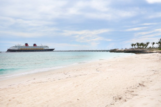 A view from the family beach at Disney Lookout Cay at Lighthouse Point, on Saturday, June 8, 2024, of the Disney Magic docked at the bridge that leads to Disney's newest destination on the island of Eleuthera in the Bahamas. (Rich Pope, Orlando Sentinel)