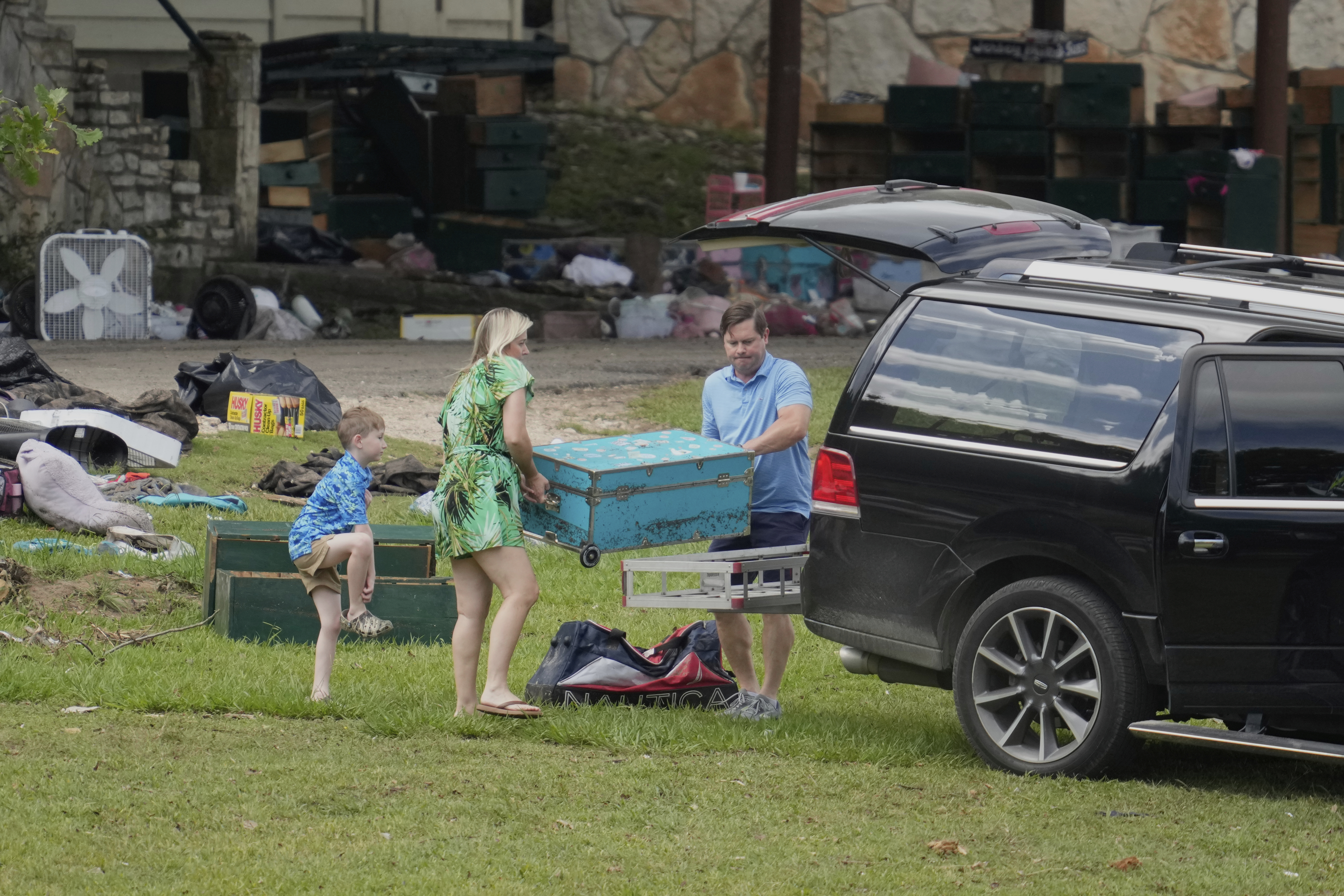 People come to pick up items at Camp Mystic in...