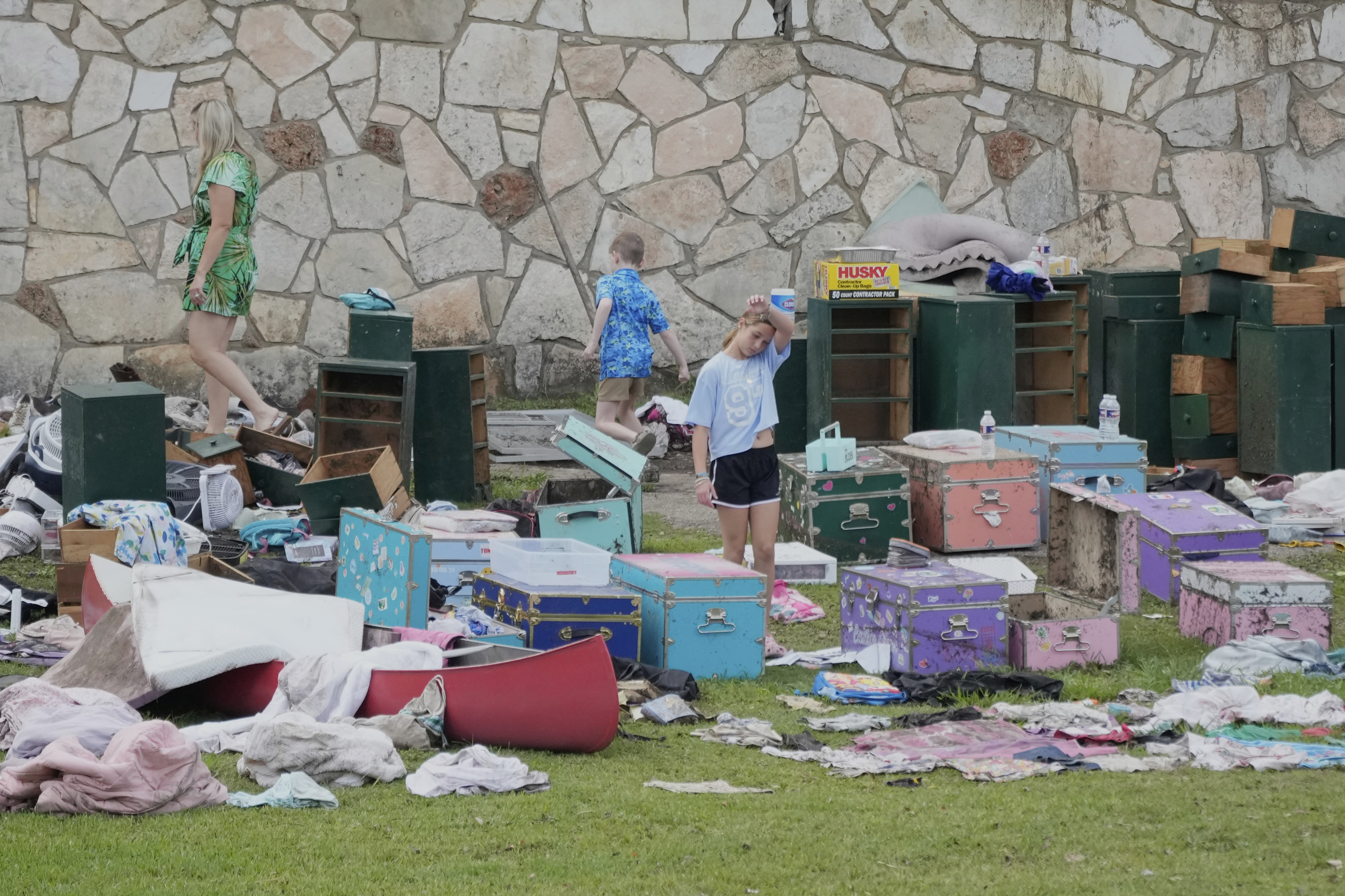 People come to pick up items at Camp Mystic in...