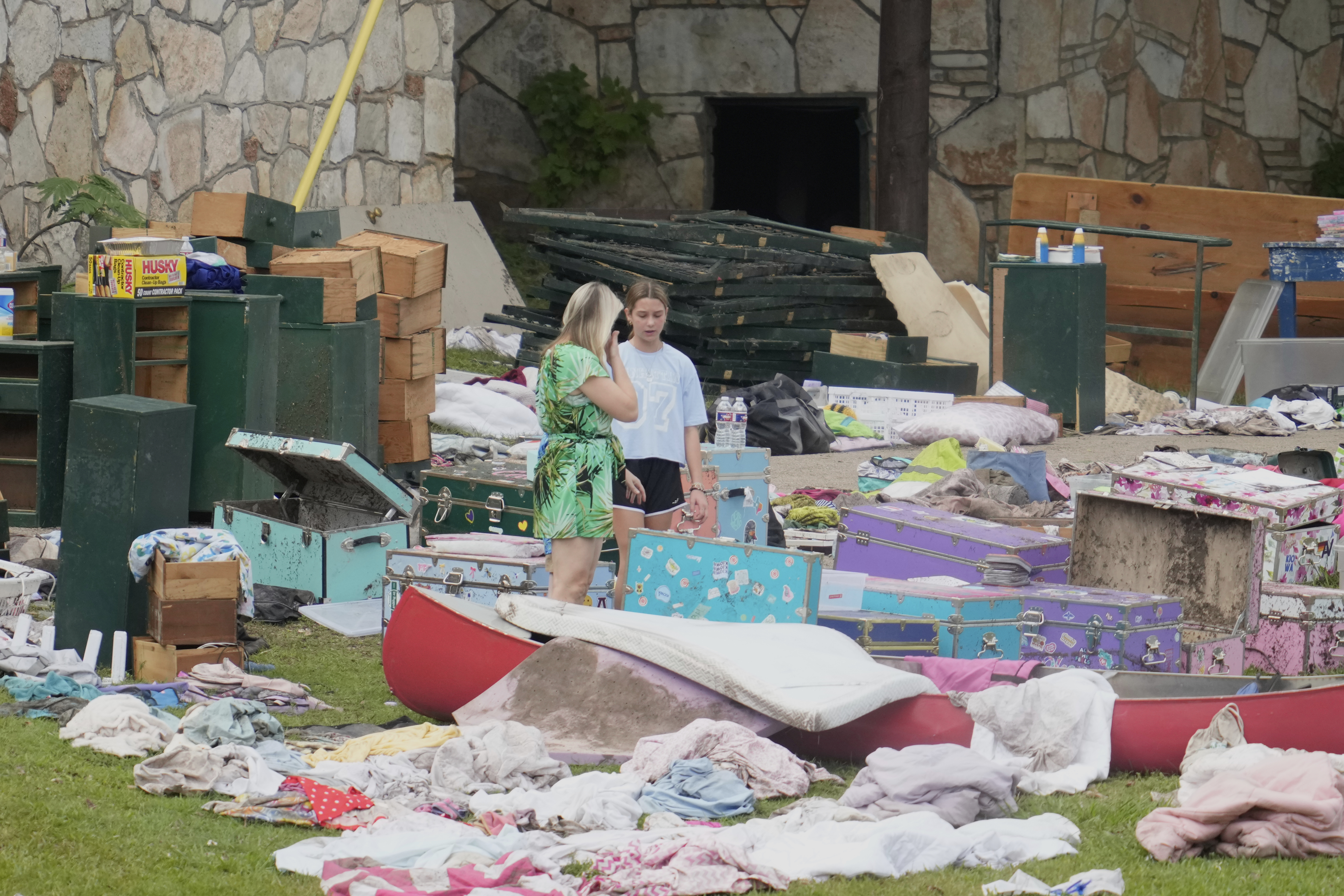 People come to pick up items at Camp Mystic in...
