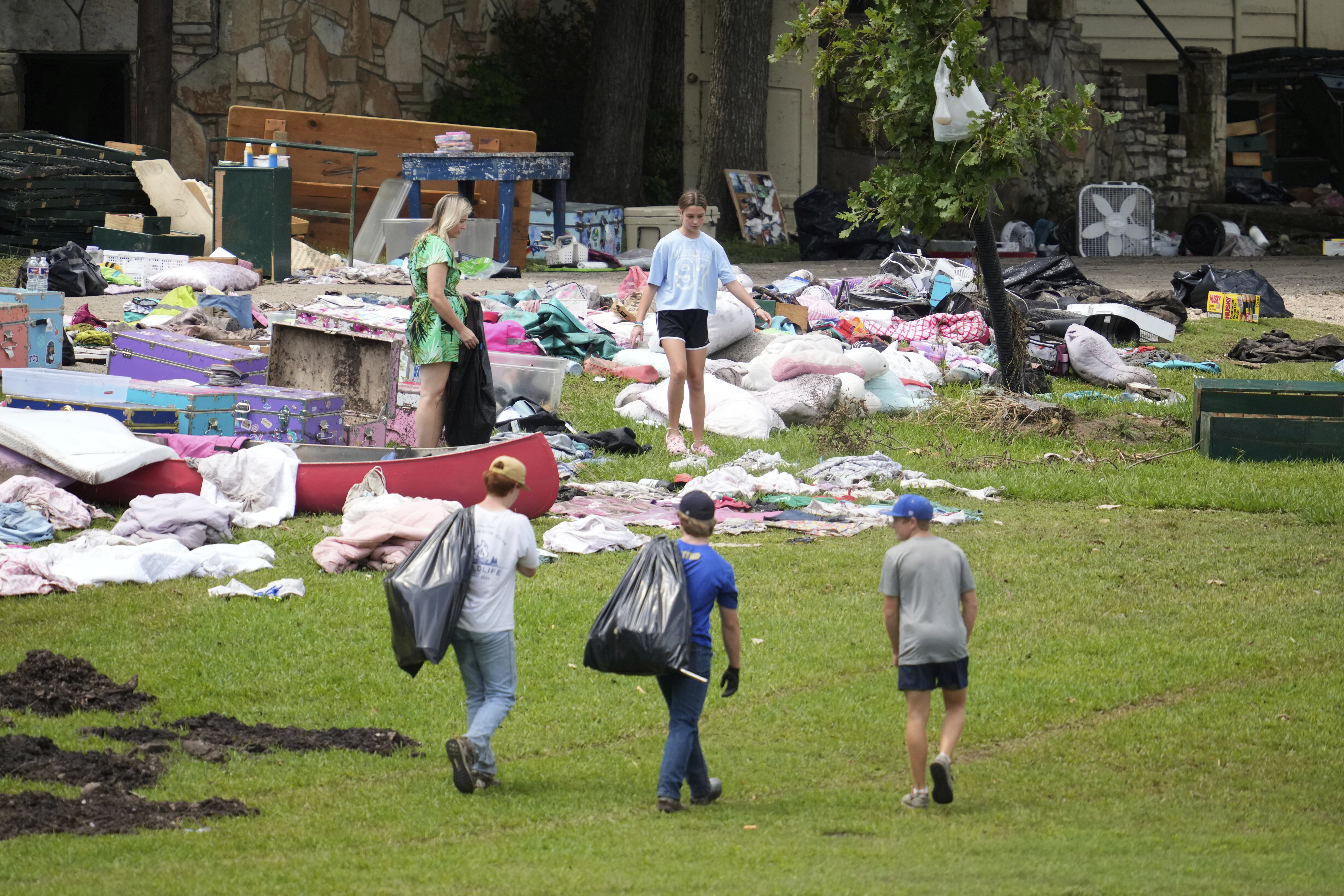 People come to pick up items at Camp Mystic in...