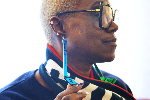 Charone Gray-Edwards, Laila Edwards' mother, displays hockey stick earrings with Laila's name and jersey number.