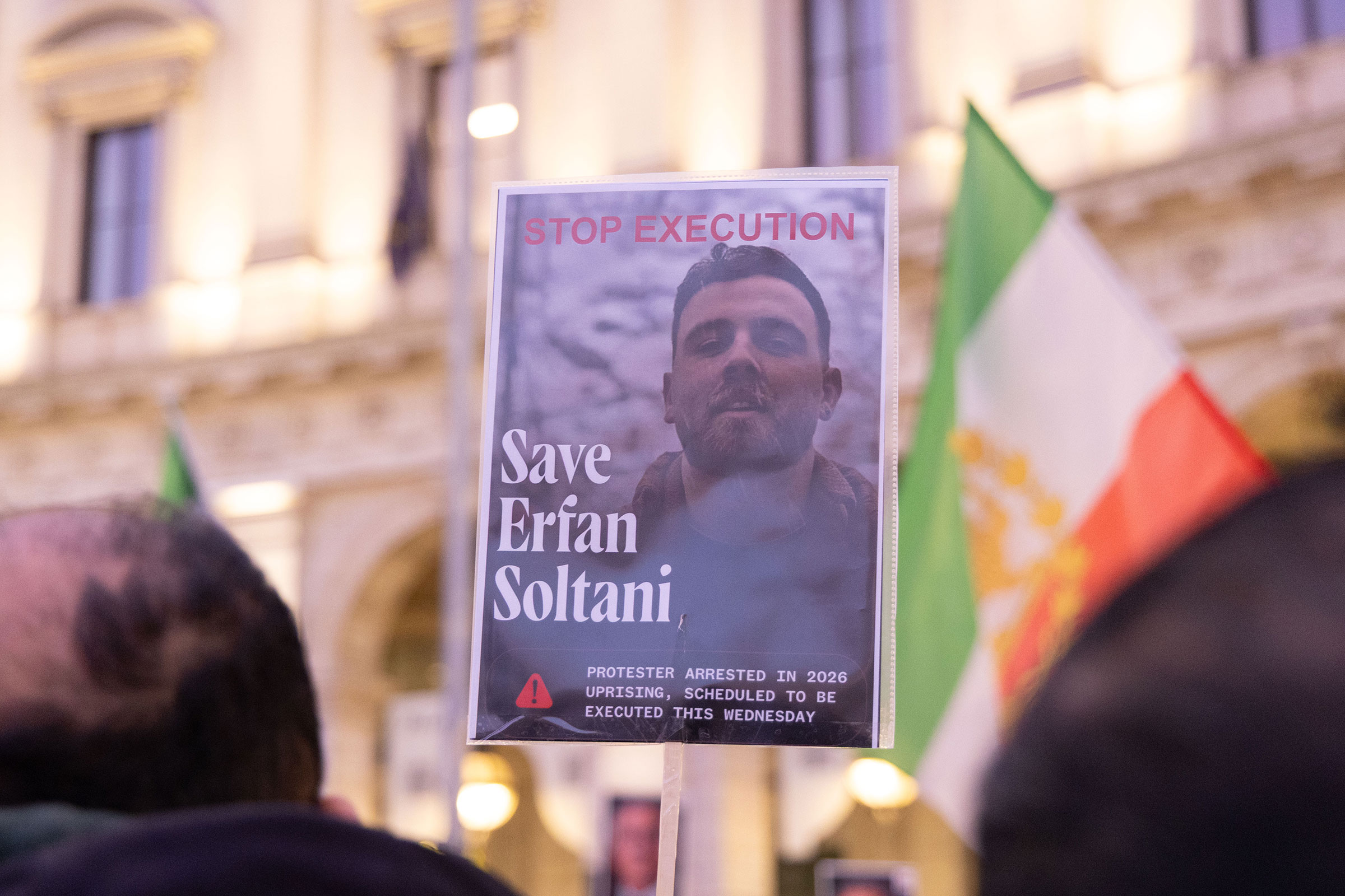 A signed, held by a protestor during a sit-in at the Piazza della Repubblica in Rome, showing Efran Soltani