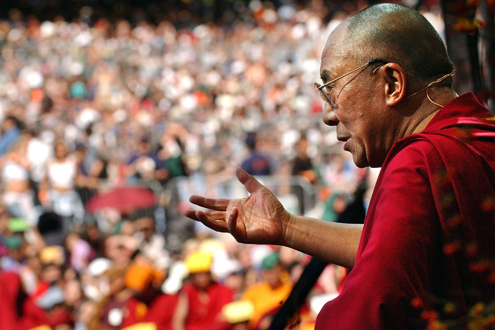 The Dalai Lama speaks during a free lecture in the east meadow of Central Park in New York City on Sept. 21, 2003.