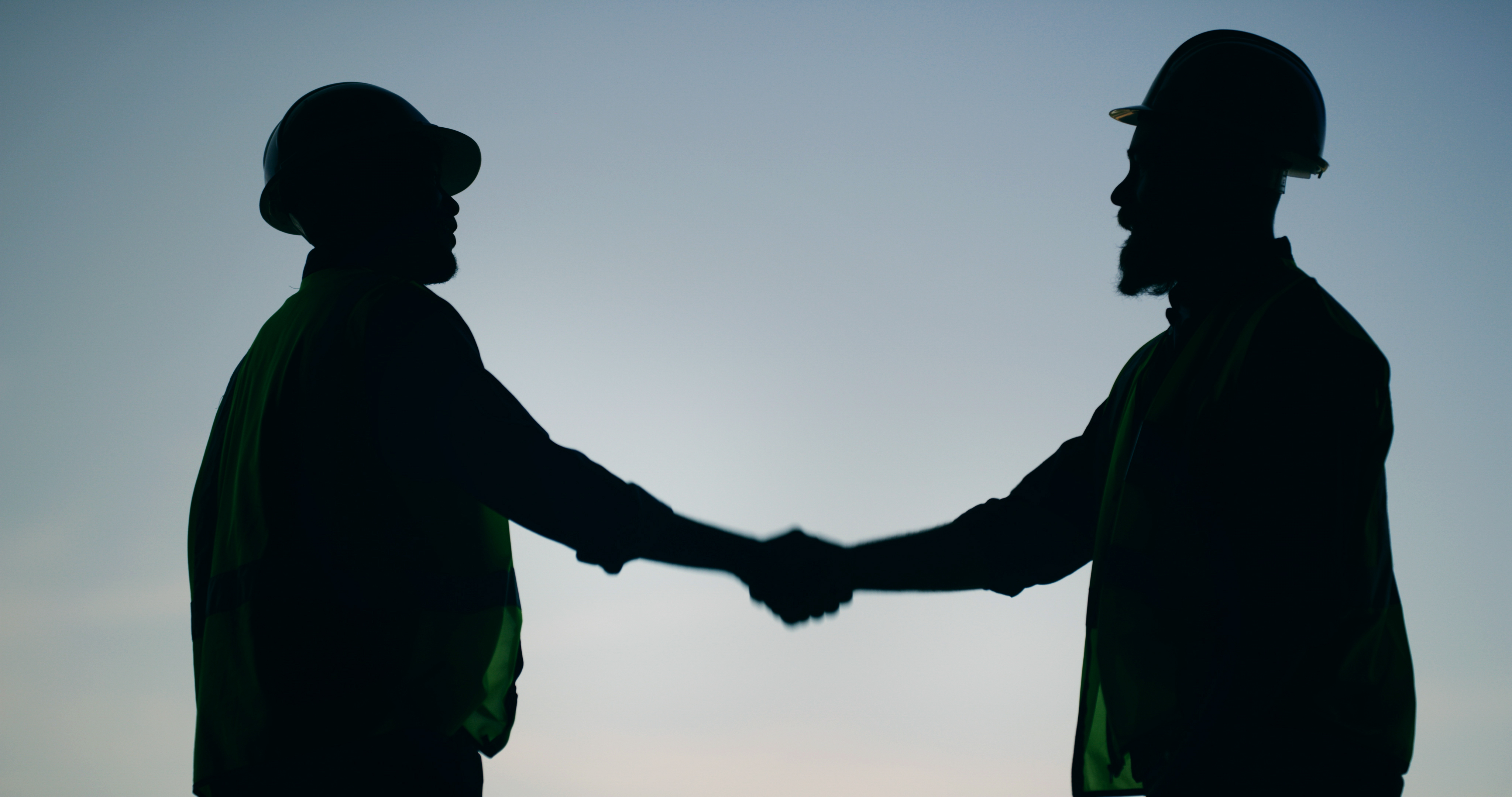 Two people shake hands 