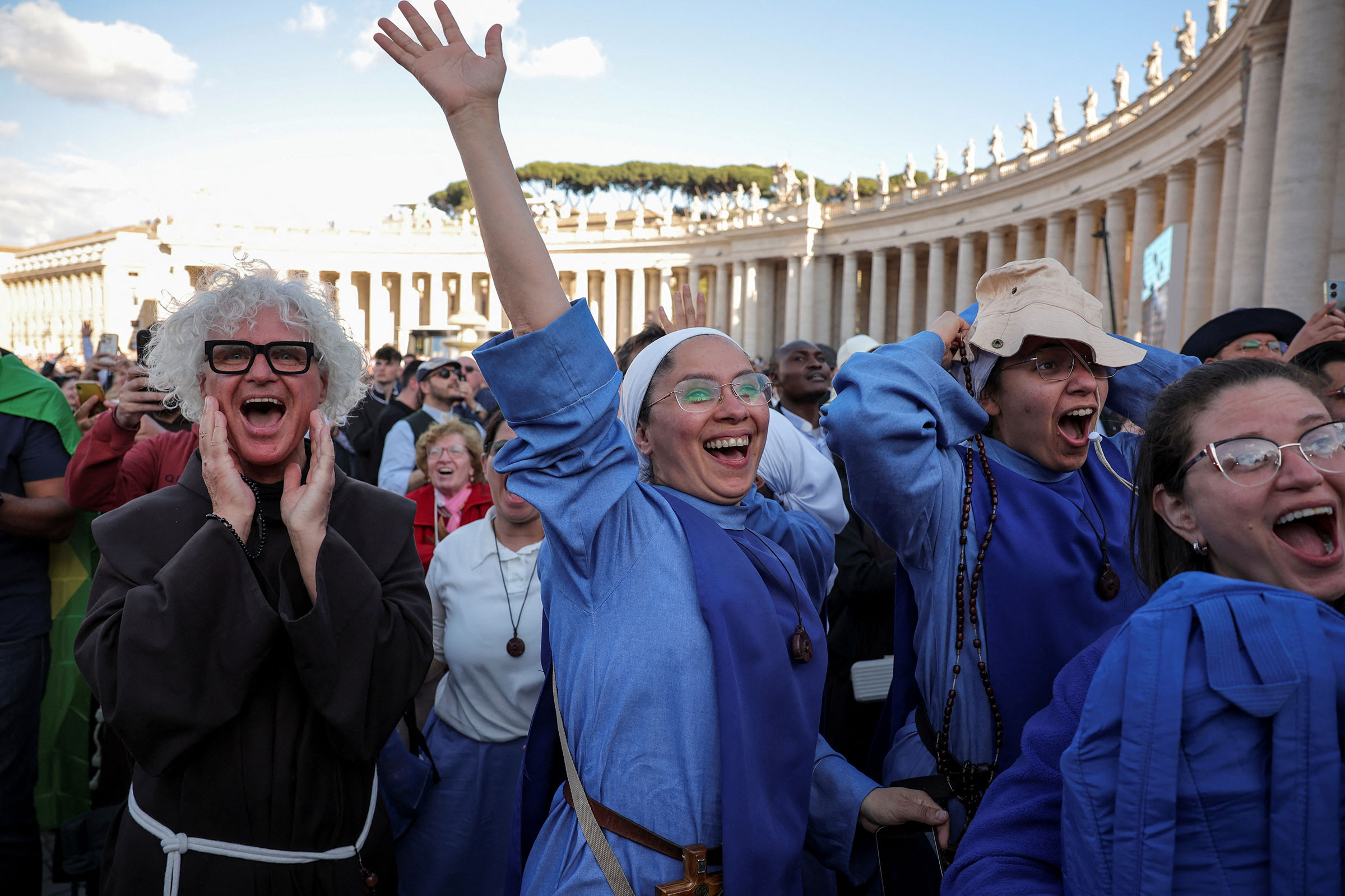 Nuns react to white smoke from the chimney on the Sistine Chapel, indicating that a new pope has been elected, at the Vatican, May 8, 2025.