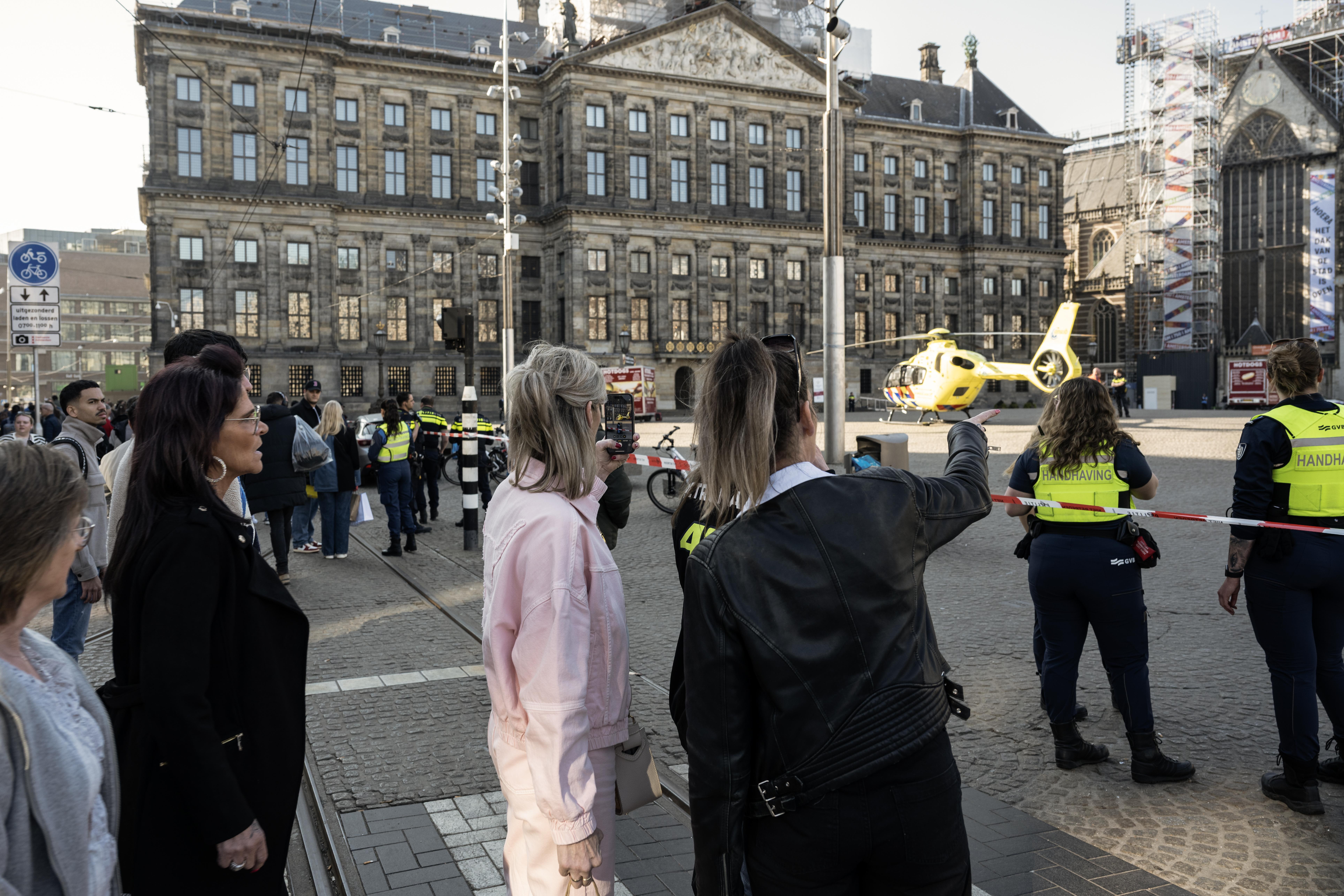Emergency helicopter landing in Amsterdam's Dam Square following a stabbing.