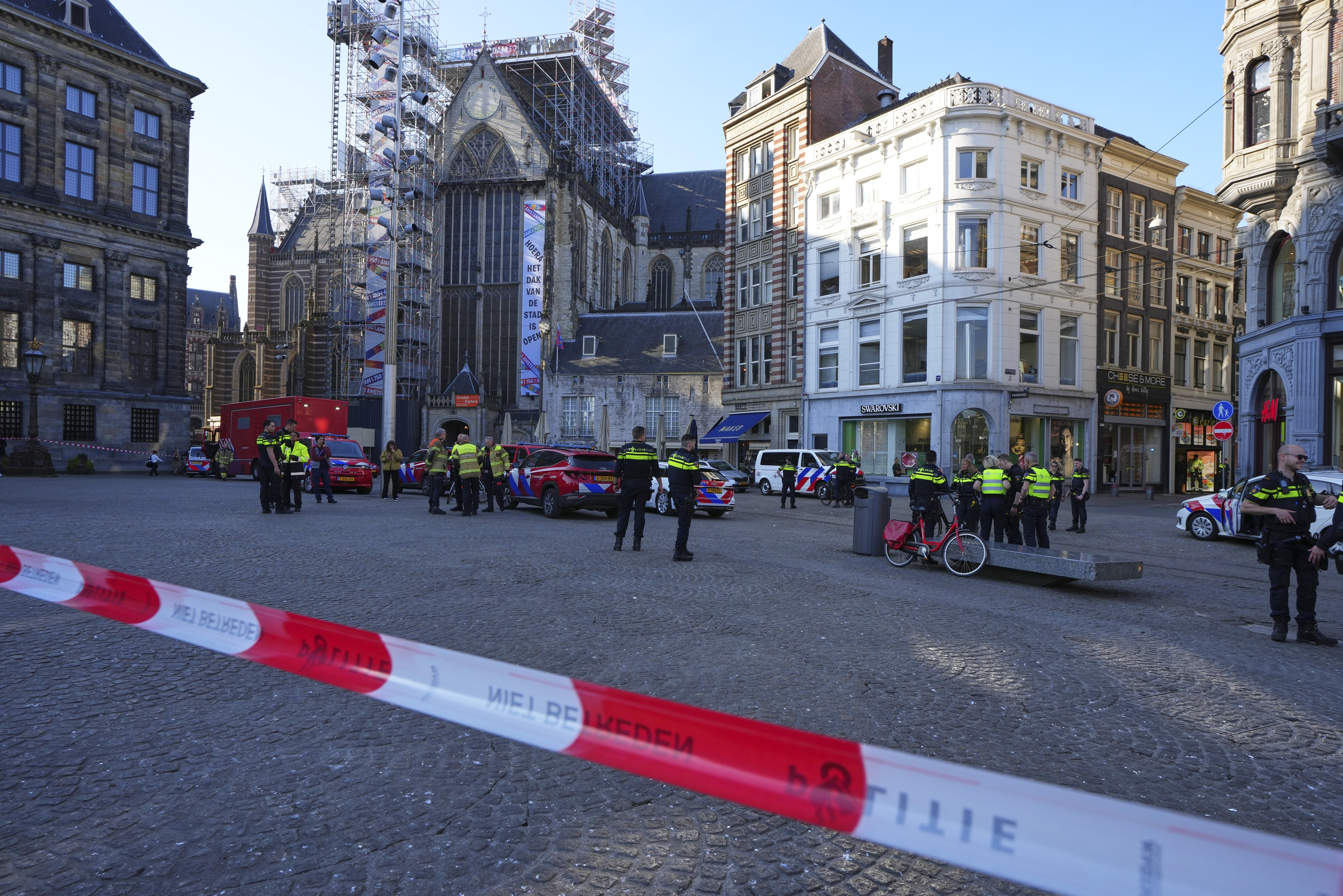 Police officers at a crime scene near Amsterdam's Dam Square.