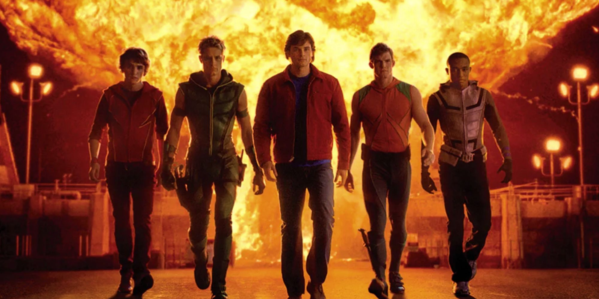 Smallville Justice League Team Roster walking in front of an explosion