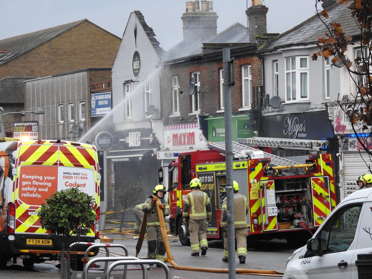 In the early hours of Sunday morning, a significant fire broke out at a flat above a shop on High Road in Chadwell Heath, requiring the response of twelve fire engines and around 80 firefighters. The fire engulfed the entire roof and most of two flats on the first floor. Emergency crews from Ilford, Dagenham, Romford, Hainault, and other nearby fire stations worked to contain the blaze, which was brought under control by 7:29 am. Flat Fire In Chadwell Heath Leaves Child Hospitalised Residents Escape as Child Hospitalised Three people were able to leave the building before the London Fire Brigade arrived. All were treated at the scene by London Ambulance Service crews, and a child was taken to the hospital. The extent of the child???s injuries has not yet been disclosed. Investigation Underway The cause of the fire is currently under investigation. Control officers received the first call at 4:06 am, prompting a rapid response to the scene. This incident has left the local community shocked, and authorities are urging residents in the area to remain vigilant as investigations continue. Updates will follow as more details become available.