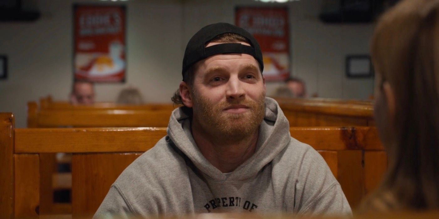 Shoresy looking frustrated sitting at a dinner table