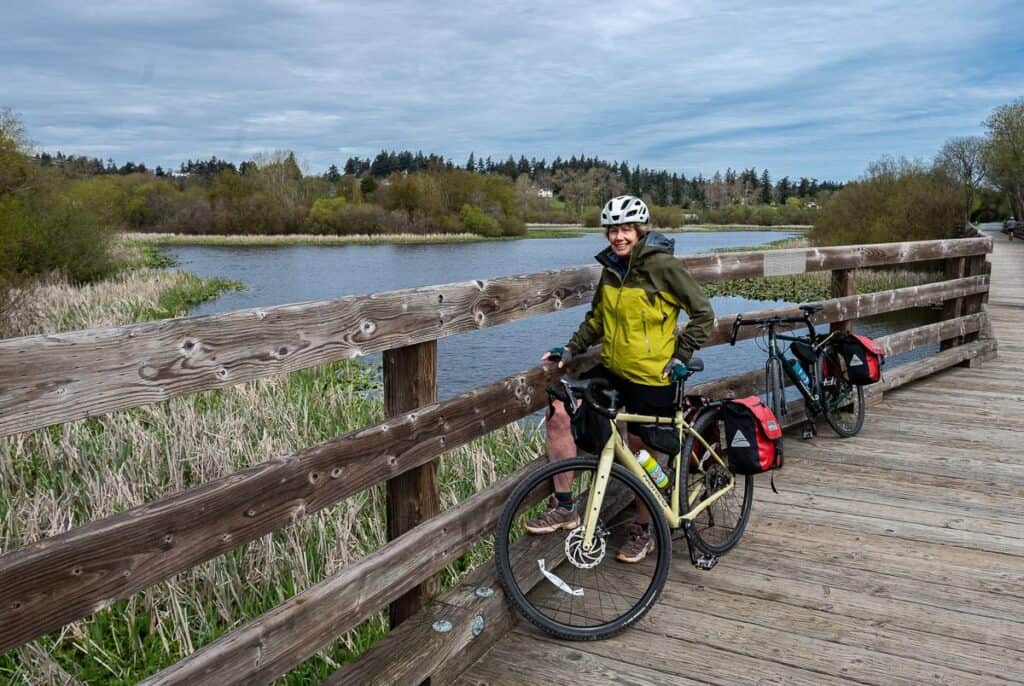 Stopping to look for birds on the large wooden bridge on the Lochside Trail