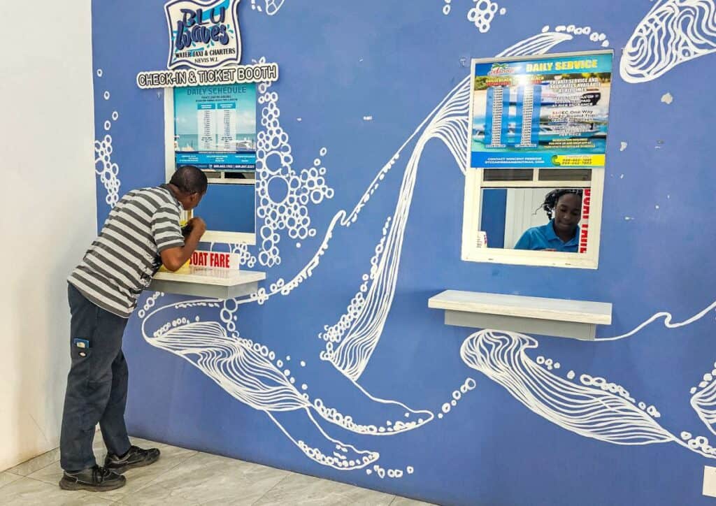 Buying tickets for the water taxi on Nevis