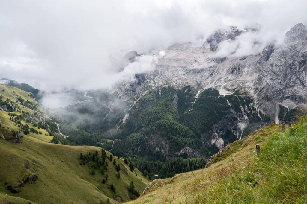 Looking down to Lago di Fedaia - our goal is a bus that travels beside the reservoir