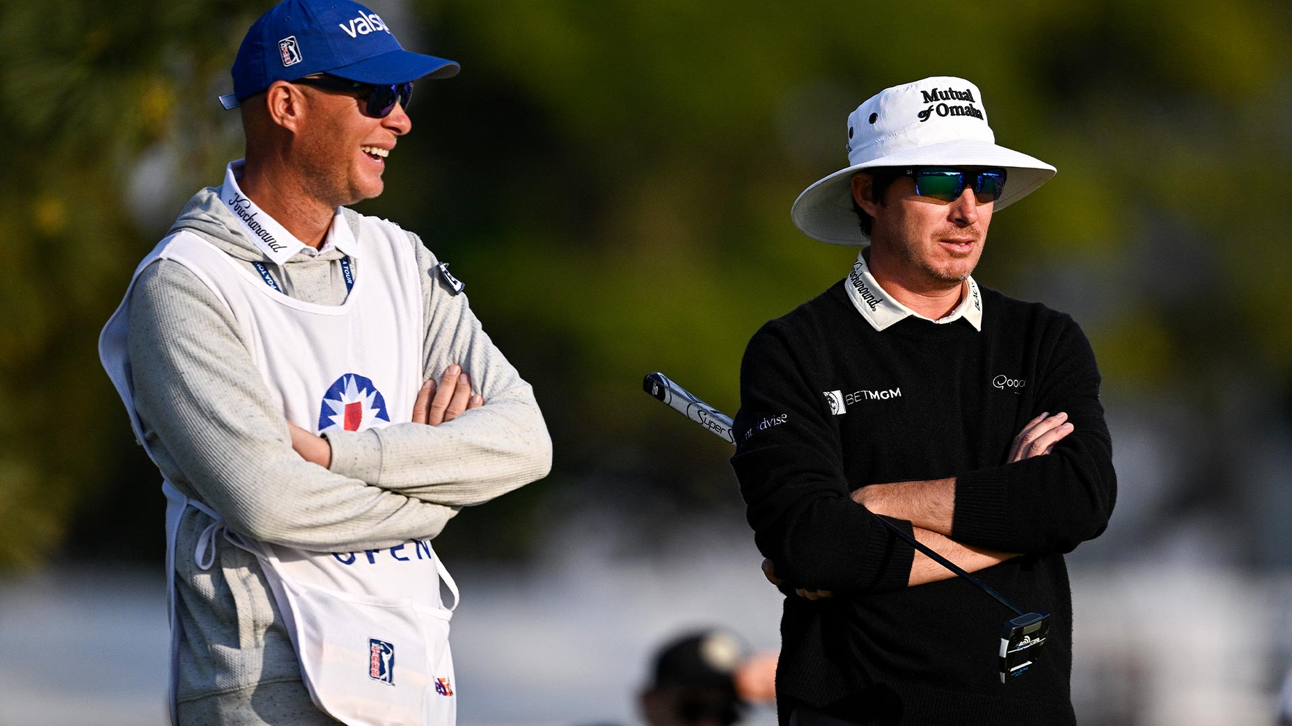 geno bonnalie and joel dahmen stand next to one another at golf tournament