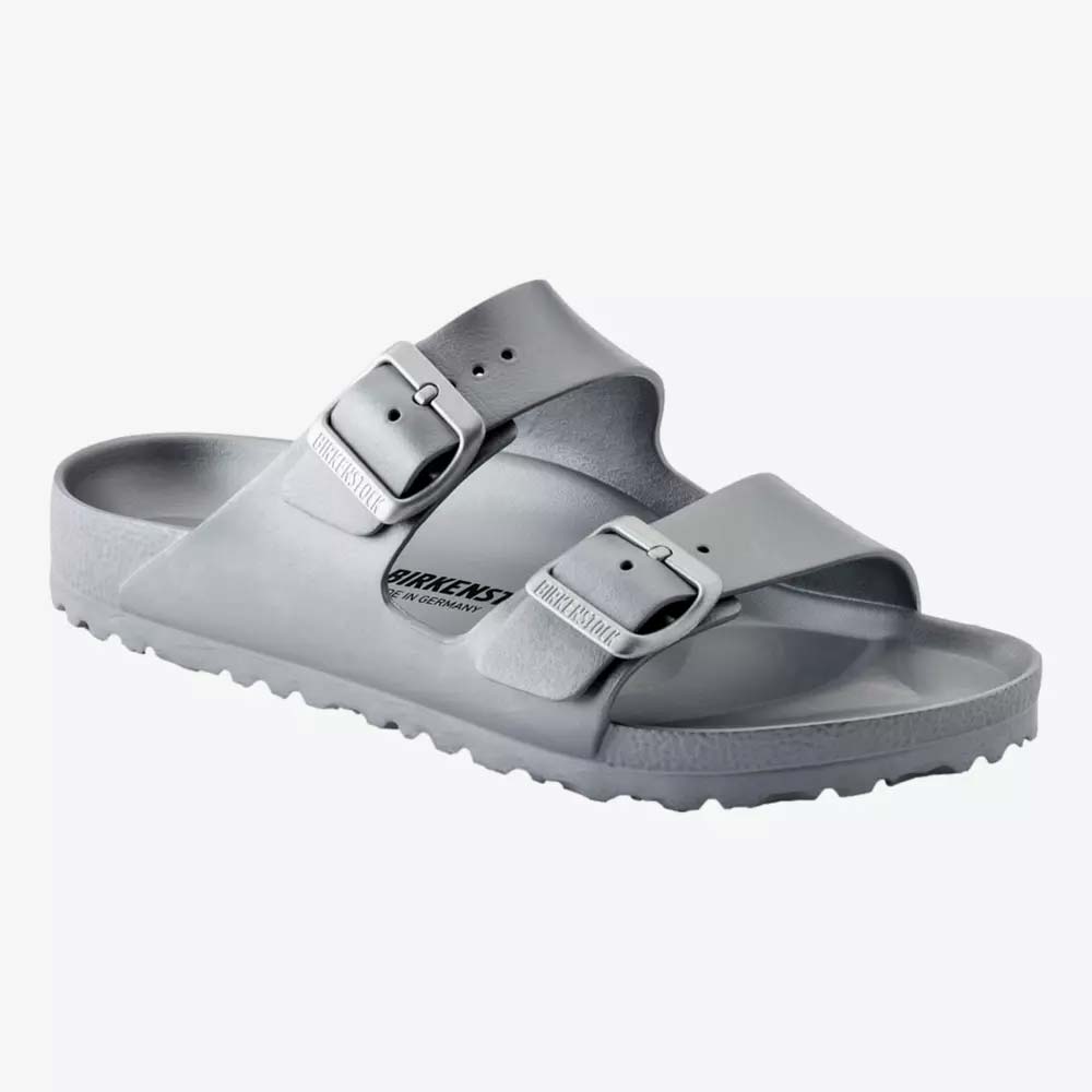A gray sandal with two adjustable buckle straps and a textured sole, displayed on a white background. The Birkenstock logo is printed on the footbed&mdash;perfect for Mother&rsquo;s Day gifts or as one of the best gifts under $50.