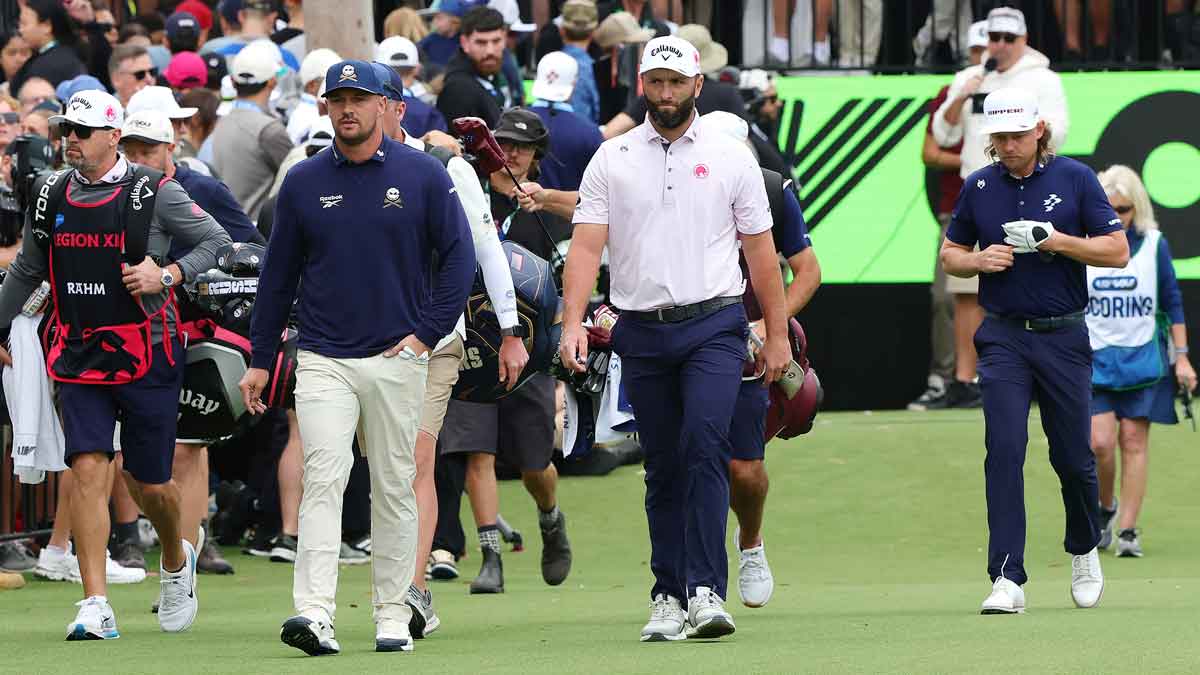 Bryson DeChambeau of the Crushers GC and Jon Rahm of Legion XIII and Cameron Smith of Ripper GC walk down the 1st during day one of LIV Adelaide