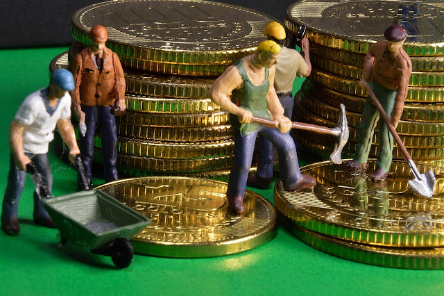 Men working around Money