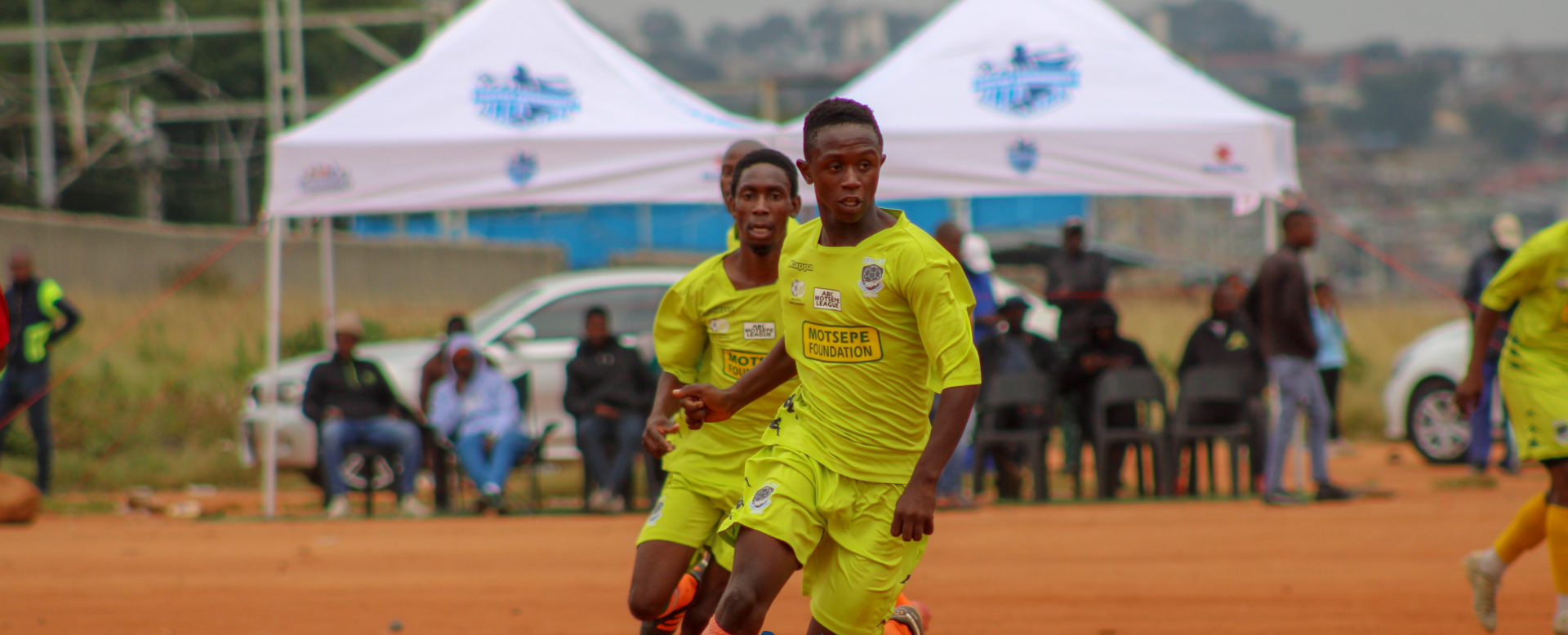 Two men playing soccer on the field